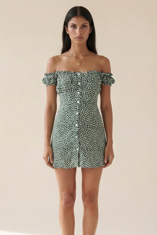 Woman wearing a green patterned off-shoulder dress on a beige background